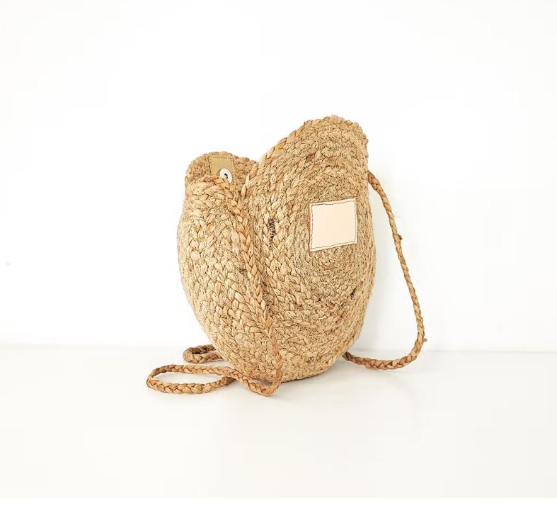 The Code Spain Ronde Schoudertas met beige voorvakje staand