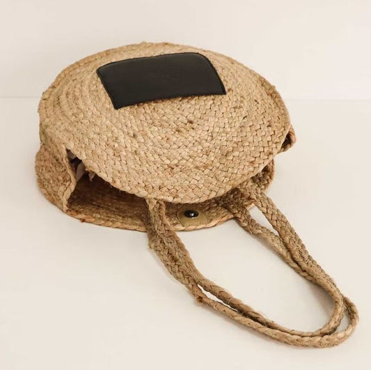 The Code Spain Ronde Draagtas met zwart voorvakje liggend